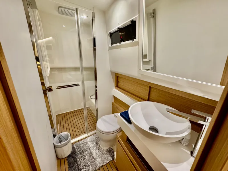 Slide: The Image of Modern bathroom in 2023 Pardo Yachts 50, featuring sleek design and wooden accents. - 25