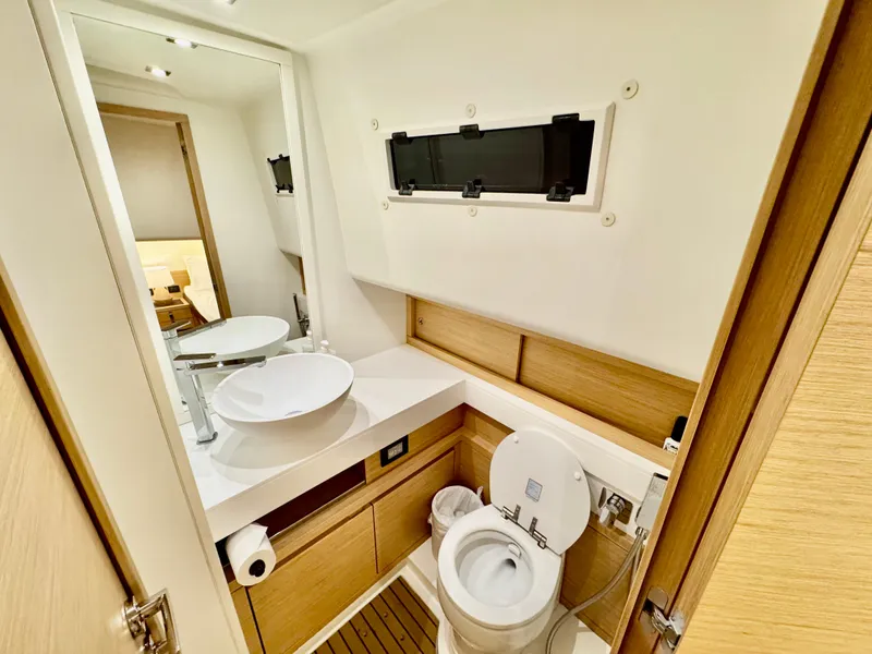 Slide: The Image of Modern bathroom in 2023 Pardo Yachts 50, featuring sleek design and wooden accents. - 28