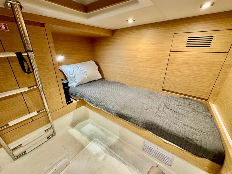 Slide: The Image of 2023 Pardo Yachts 50 cabin interior with single bed and modern wood finish. - 29