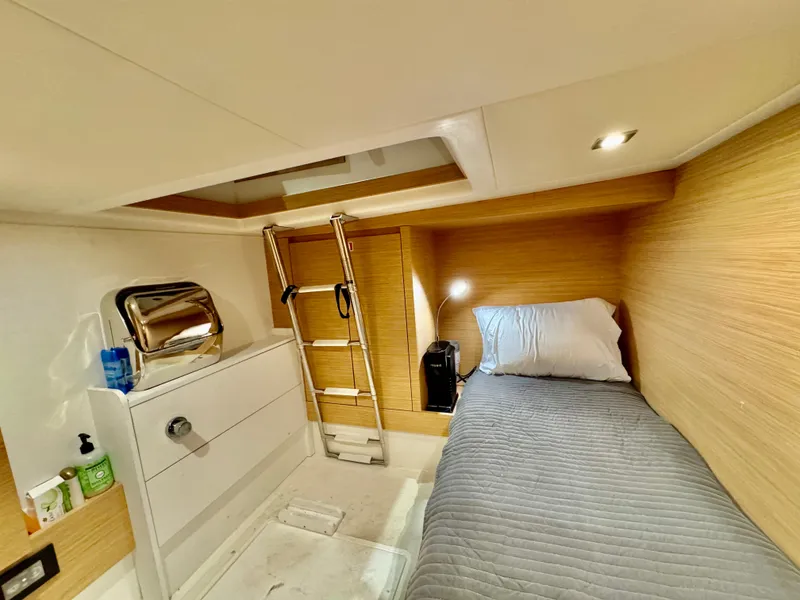 Slide: The Image of 2023 Pardo Yachts 50 cabin interior with single bed, ladder, and modern lighting. - 30