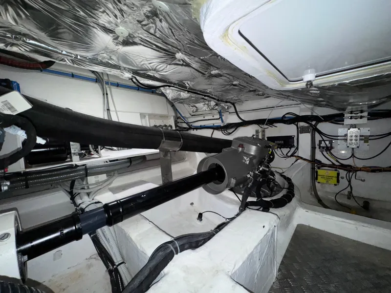 Slide: The Image of Engine room of 2023 Pardo Yachts 50, showcasing mechanical components and wiring. - 34