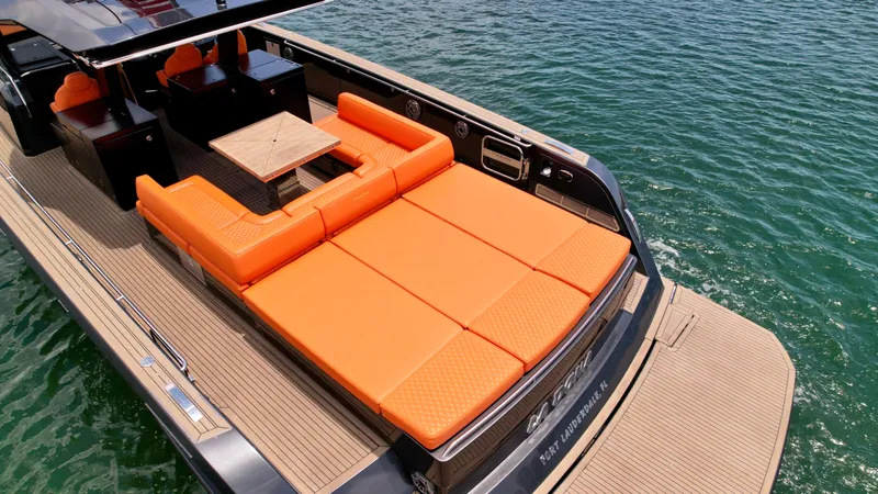Slide: The Image of 2023 Pardo Yachts 50 with orange seating, spacious deck, and elegant design on the water. - 5