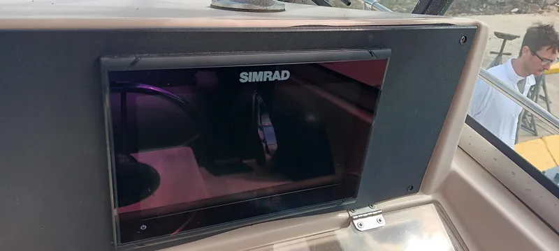 Slide: The Image of Simrad display on 1997 Grady-White Seafarer 226 boat dashboard. - 10