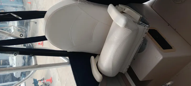 Slide: The Image of 1997 Grady-White Seafarer 226 boat interior with white captain's chair. - 9