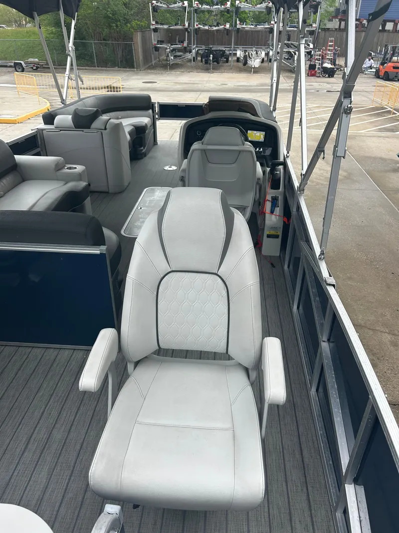 Slide: The Image of 2021 Avalon Catalina 24' pontoon boat interior with plush seating and modern design. - 15
