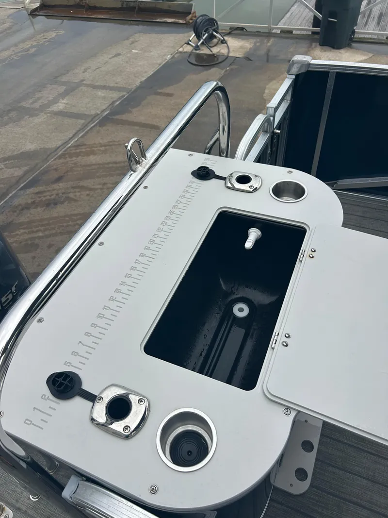 Slide: The Image of 2021 Avalon Catalina 24' boat deck with fishing station and utility features. - 16