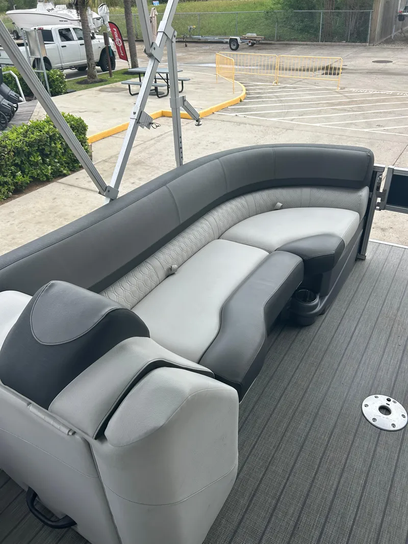Slide: The Image of 2021 Avalon Catalina 24' boat interior with gray seating and modern design. - 26