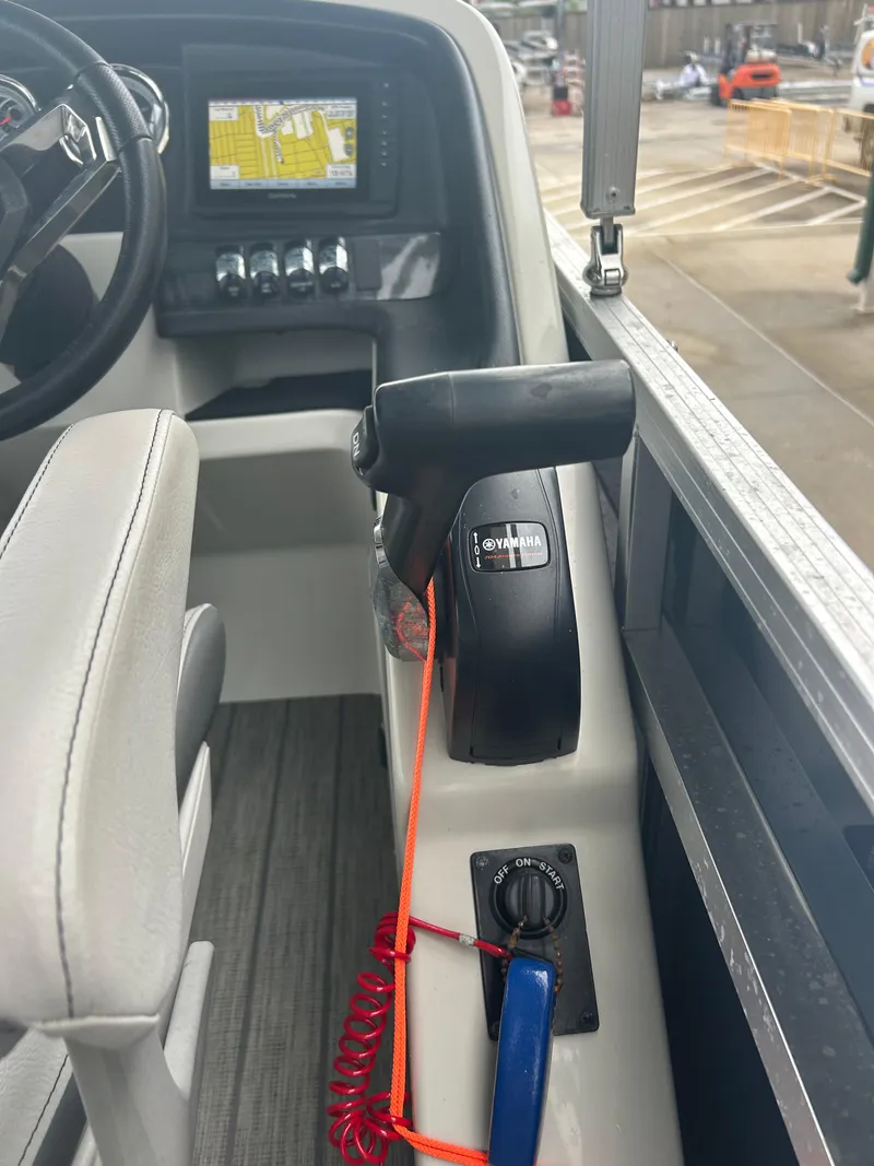 Slide: The Image of Interior of 2021 Avalon Catalina boat showing control panel and steering. - 28