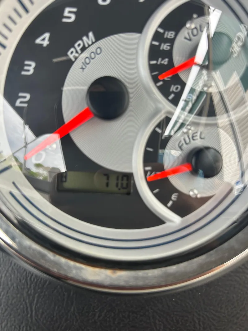 Slide: The Image of Close-up of 2021 Avalon Catalina boat gauge showing RPM, voltage, and fuel levels. - 30