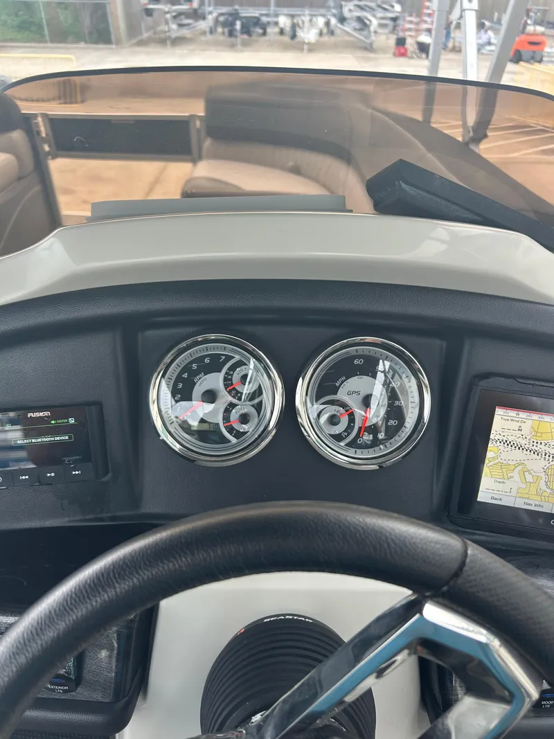 Slide: The Image of 2021 Avalon Catalina 24' dashboard with gauges and navigation system. - 32