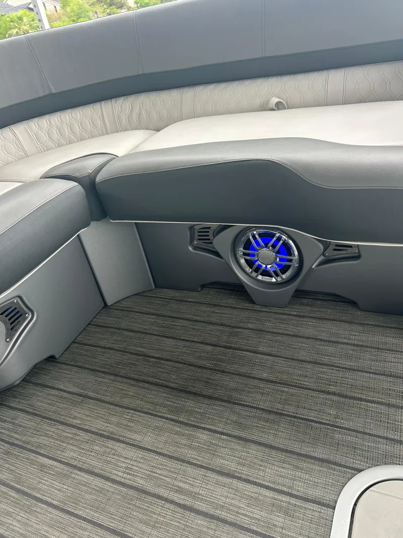 Slide: The Image of 2021 Avalon Catalina 24' boat interior with sleek seating and modern speaker system. - 34