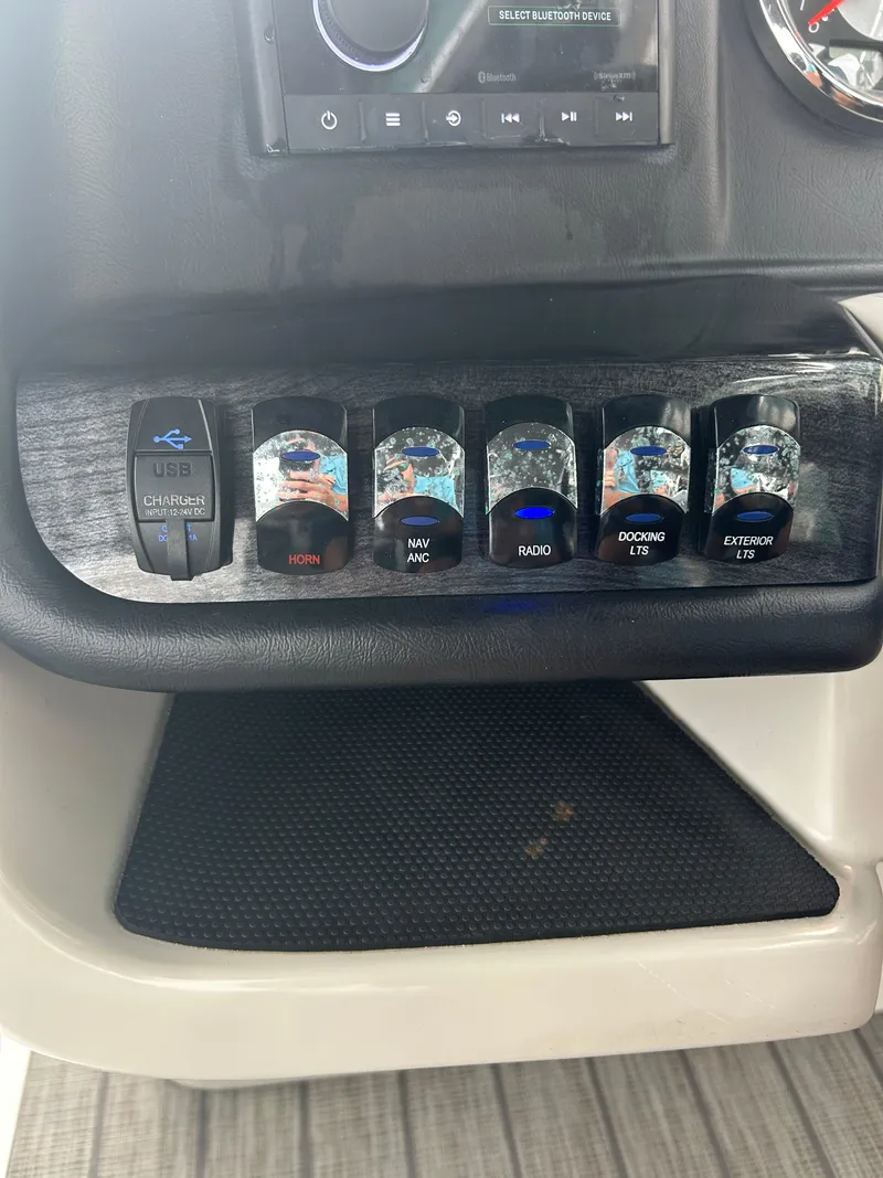 Slide: The Image of Control panel of 2021 Avalon Catalina 24' boat with labeled switches. - 35