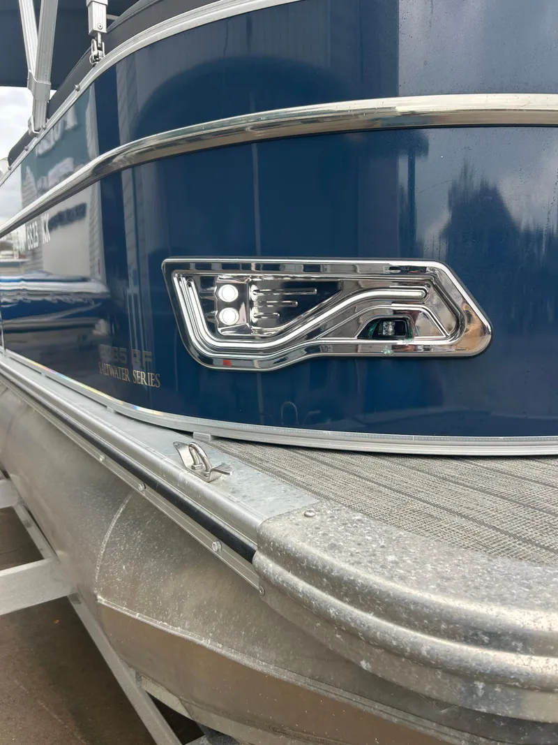 Slide: The Image of 2021 Avalon Catalina 24' pontoon boat with sleek blue exterior and modern design. - 37