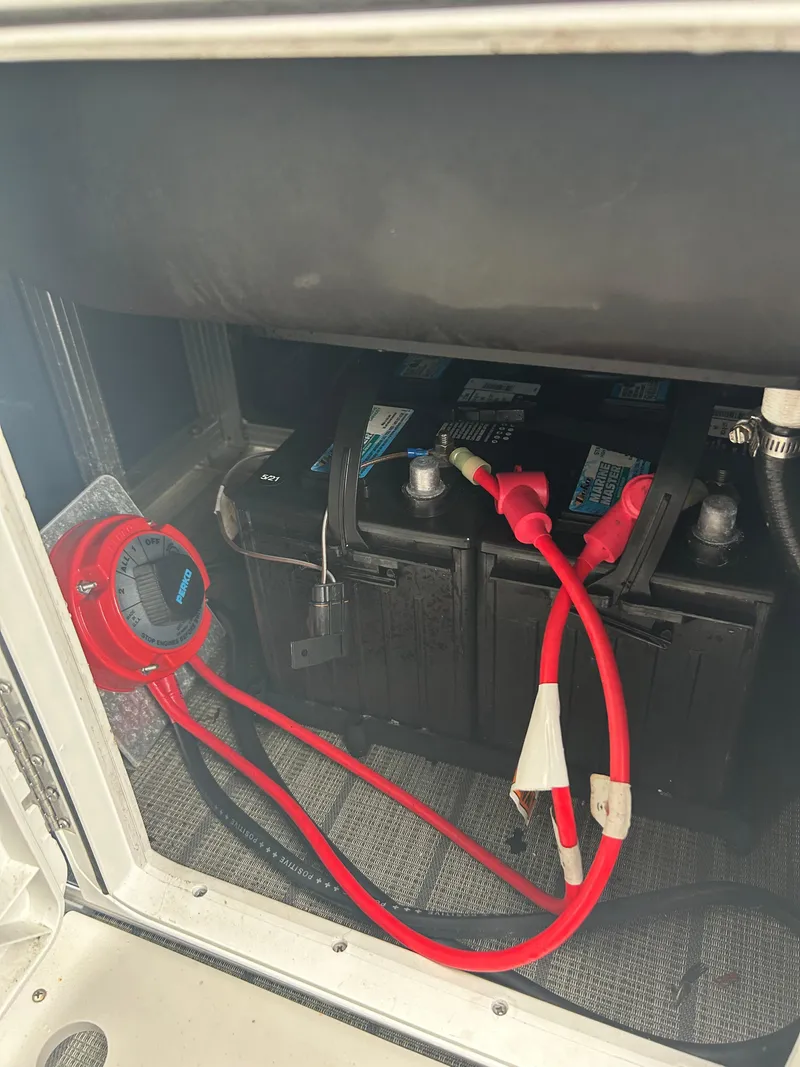 Slide: The Image of Battery compartment of 2021 Avalon Catalina 24' with red cables connected. - 39