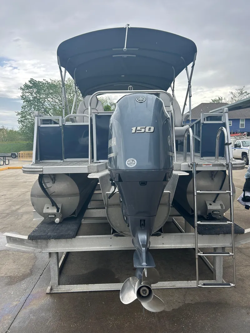 Slide: The Image of 2021 Avalon Catalina 24' pontoon boat with 150 HP engine, rear view. - 9