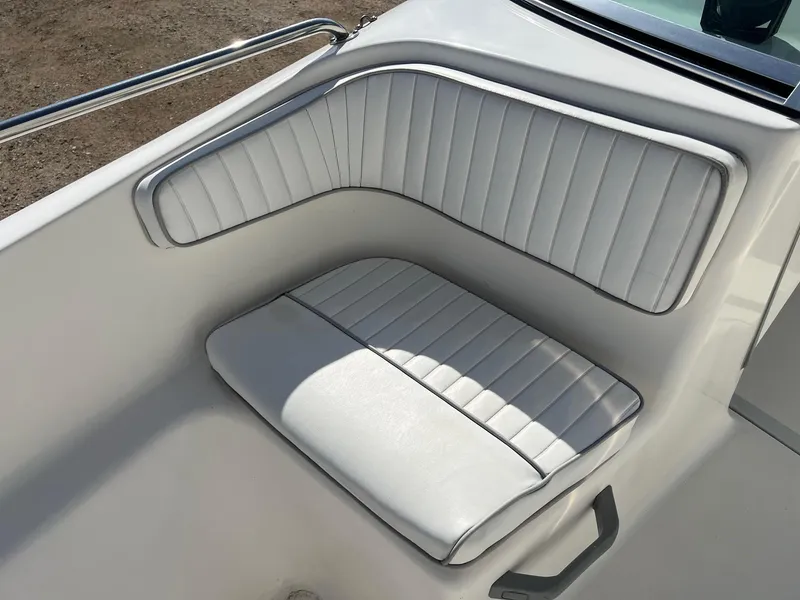 Slide: The Image of White cushioned seating on a 1995 Boston Whaler 170 Dauntless boat. - 12