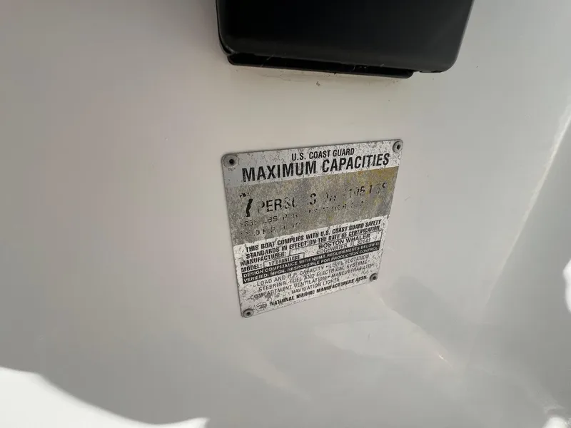 Slide: The Image of Capacity plate on 1995 Boston Whaler 170 Dauntless, showing U.S. Coast Guard maximum capacities. - 18