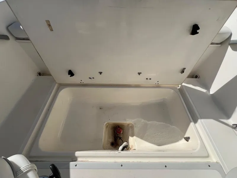 Slide: The Image of Open storage compartment on a 1995 Boston Whaler 170 Dauntless boat. - 20