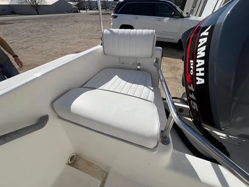 Slide: The Image of 1995 Boston Whaler 170 Dauntless boat with Yamaha V115 engine, featuring white seating. - 22