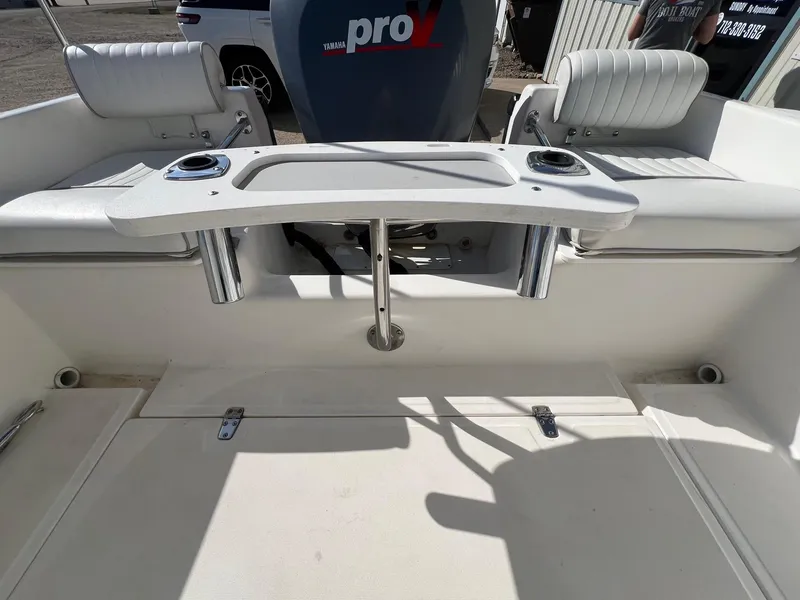Slide: The Image of 1995 Boston Whaler 170 Dauntless boat interior with seating and Yamaha engine. - 24