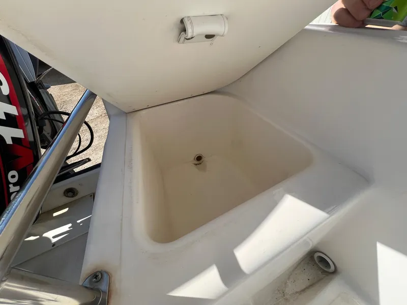 Slide: The Image of Open storage compartment on a 1995 Boston Whaler 170 Dauntless boat. - 26