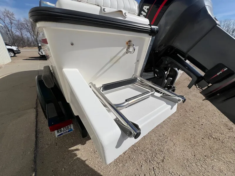 Slide: The Image of Boston Whaler 170 Dauntless 1995 boat with ladder and Yamaha outboard motor. - 28