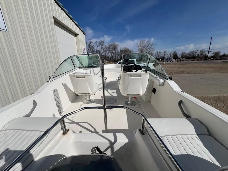Slide: The Image of 1995 Boston Whaler 170 Dauntless boat interior with seating and steering wheel. - 8