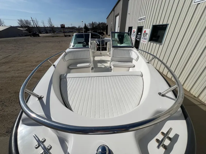 Slide: The Image of 1995 Boston Whaler 170 Dauntless boat with white seating and stainless steel railings. - 9