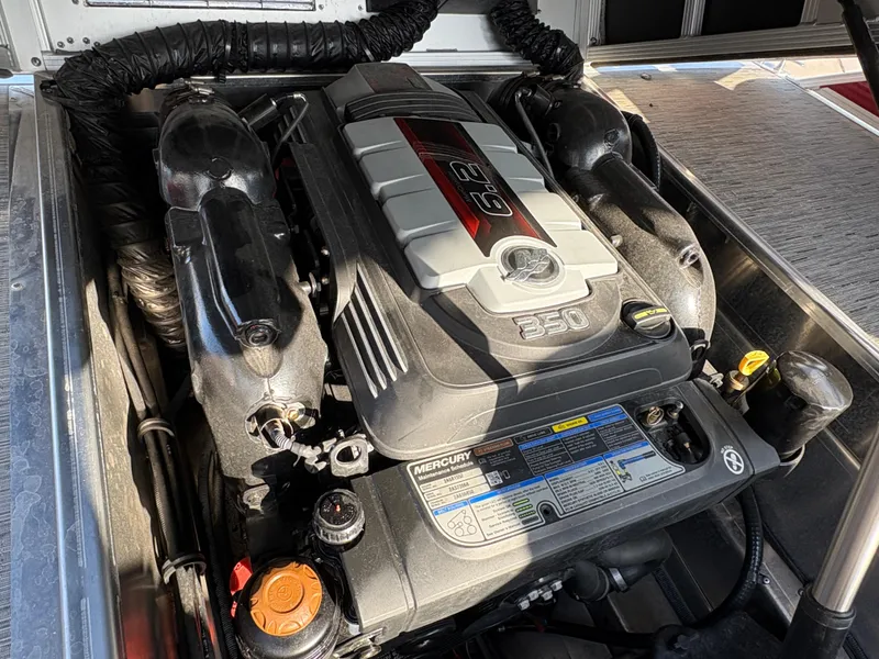 Slide: The Image of 2021 Bennington 25 QSBA IO boat engine, featuring a powerful Mercury 6.2L 350 HP motor. - 13