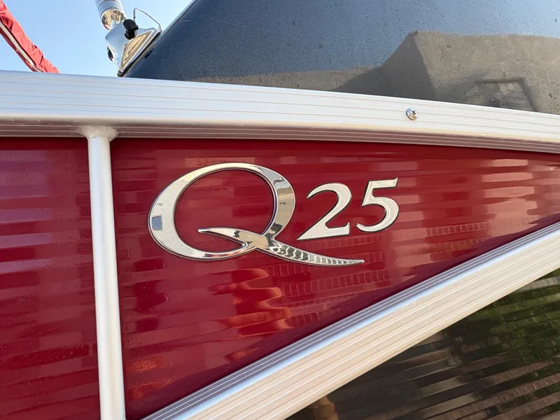 Slide: The Image of Close-up of 2021 Bennington 25 QSBA IO boat with red and silver detailing. - 5