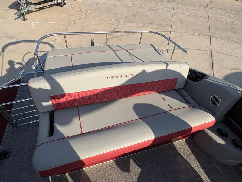 Slide: The Image of 2021 Bennington 25 QSBA IO boat seat with red and gray upholstery. - 8