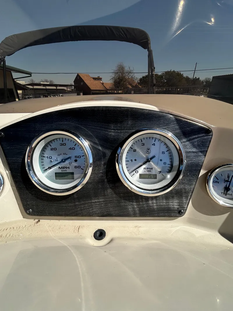 Slide: The Image of Dashboard of 2019 Harris Sunliner 240 boat with speedometer and tachometer. - 20