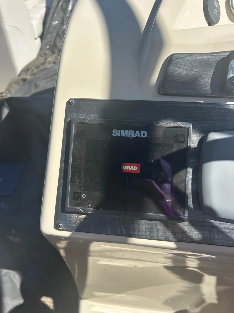Slide: The Image of Simrad display on 2019 Harris Sunliner 240 boat dashboard. - 24