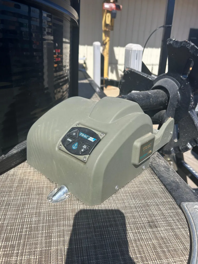 Slide: The Image of Control panel on a 2019 Harris Sunliner 240 boat, featuring navigation and operation buttons. - 32