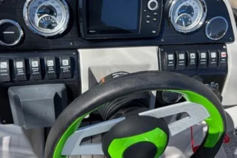 Slide: The Image of Steering wheel and dashboard of 2021 Starcraft MDX 211 E O/B boat. - 16