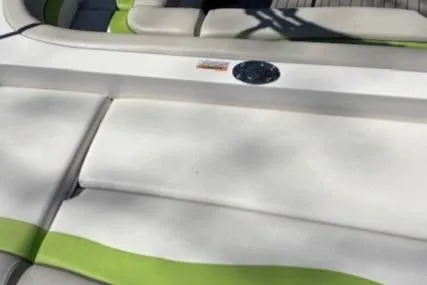 Slide: The Image of 2021 Starcraft MDX 211 E O/B boat interior with white and green seating. - 18