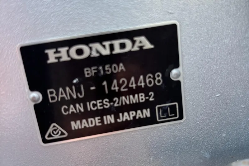 Slide: The Image of Honda engine label, model BF150A, serial BANJ-1424468, made in Japan. - 22