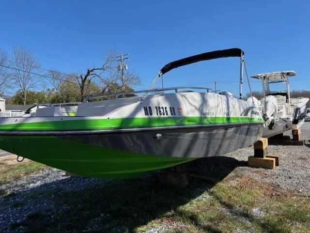 Slide: The Image of 2021 Starcraft MDX 211 E O/B boat with green and white exterior on a trailer. - 5