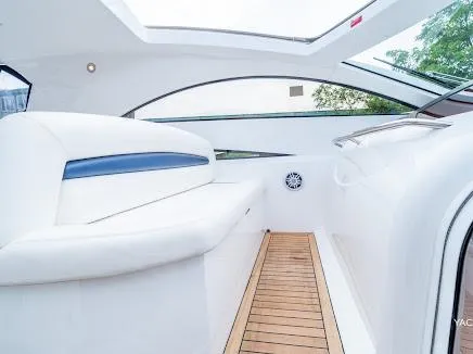 Slide: The Image of Interior of 2007 Sunseeker Predator 55 yacht with sleek white seating and wooden flooring. - 18