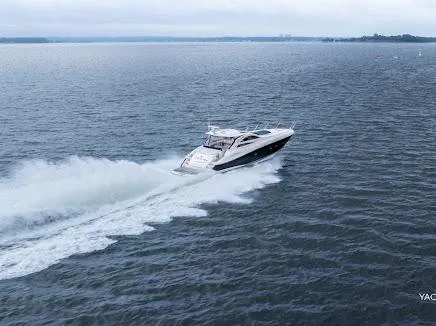 Slide: The Image of 2007 Sunseeker Predator 55 yacht cruising on open water. - 2