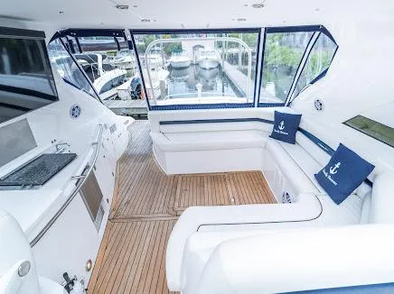 Slide: The Image of Luxurious interior of 2007 Sunseeker Predator 55 yacht with white seating and nautical decor. - 20