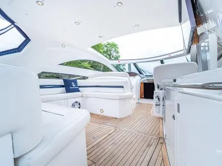Slide: The Image of Luxurious interior of 2007 Sunseeker Predator 55 yacht with sleek white seating and wooden flooring. - 22