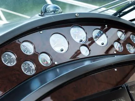 Slide: The Image of Dashboard of 2007 Sunseeker Predator 55 yacht with multiple gauges and compass. - 25