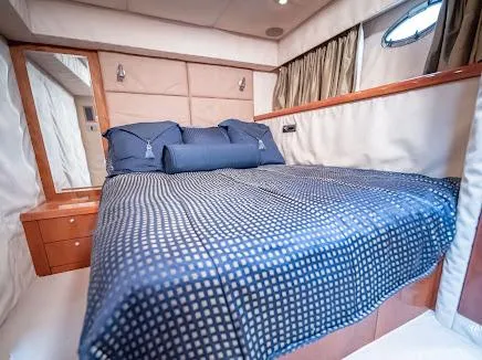 Slide: The Image of Luxurious bedroom interior of 2007 Sunseeker Predator 55 yacht with elegant bedding. - 29