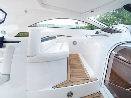Slide: The Image of Interior of 2007 Sunseeker Predator 55 yacht with sleek white seating and wooden flooring. - 30