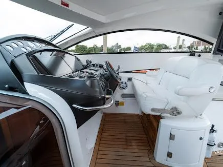 Slide: The Image of 2007 Sunseeker Predator 55 yacht cockpit with sleek design and luxurious seating. - 31