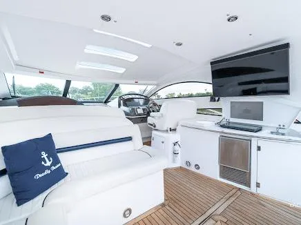 Slide: The Image of Interior of 2007 Sunseeker Predator 55 yacht with white seating and modern amenities. - 33