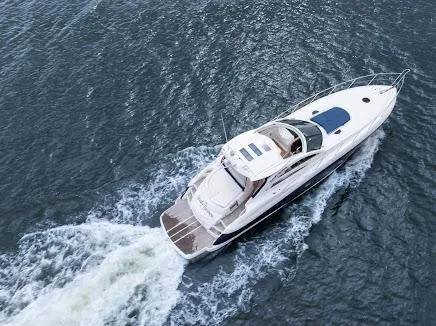 Slide: The Image of 2007 Sunseeker Predator 55 yacht cruising on open water, aerial view. - 4