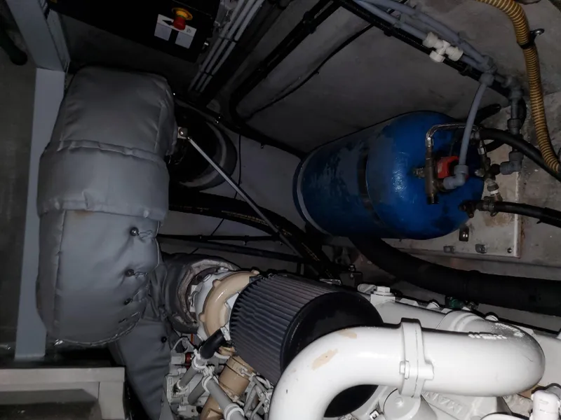 Slide: The Image of Engine room of a 2007 Sunseeker Predator 55 yacht, showcasing mechanical components. - 45