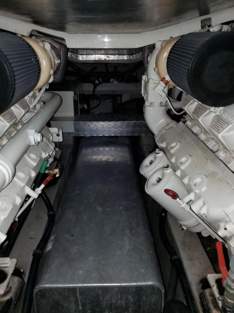 Slide: The Image of Engine room of 2007 Sunseeker Predator 55 yacht, showcasing dual engines and mechanical components. - 47